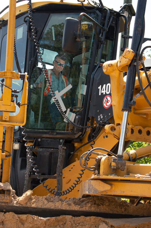 Anderson Columbia crew member operating heavy equipment